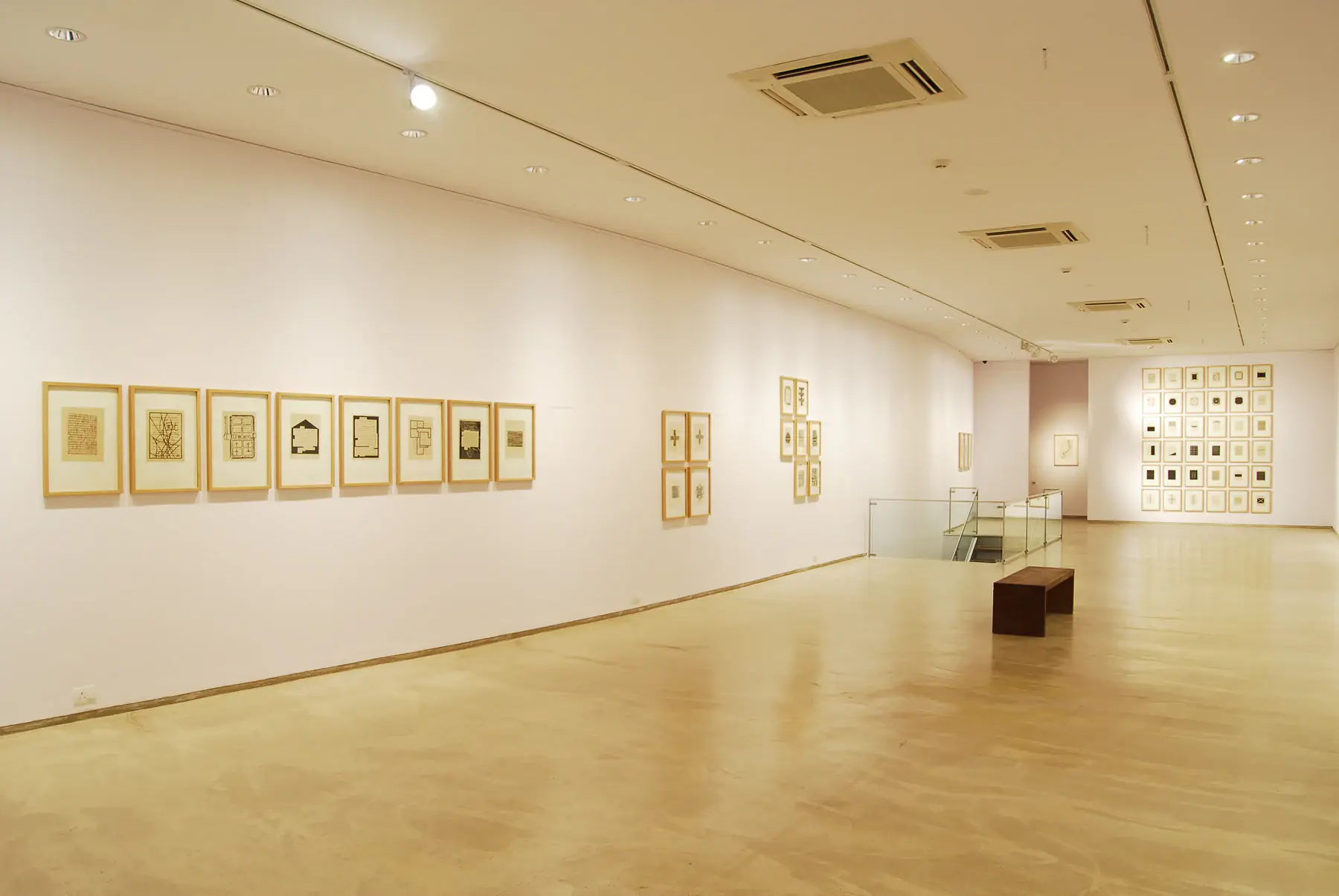 Installation view of Weaving Memory at Bodhi Art, with Zarina’s portfolios arranged across the gallery