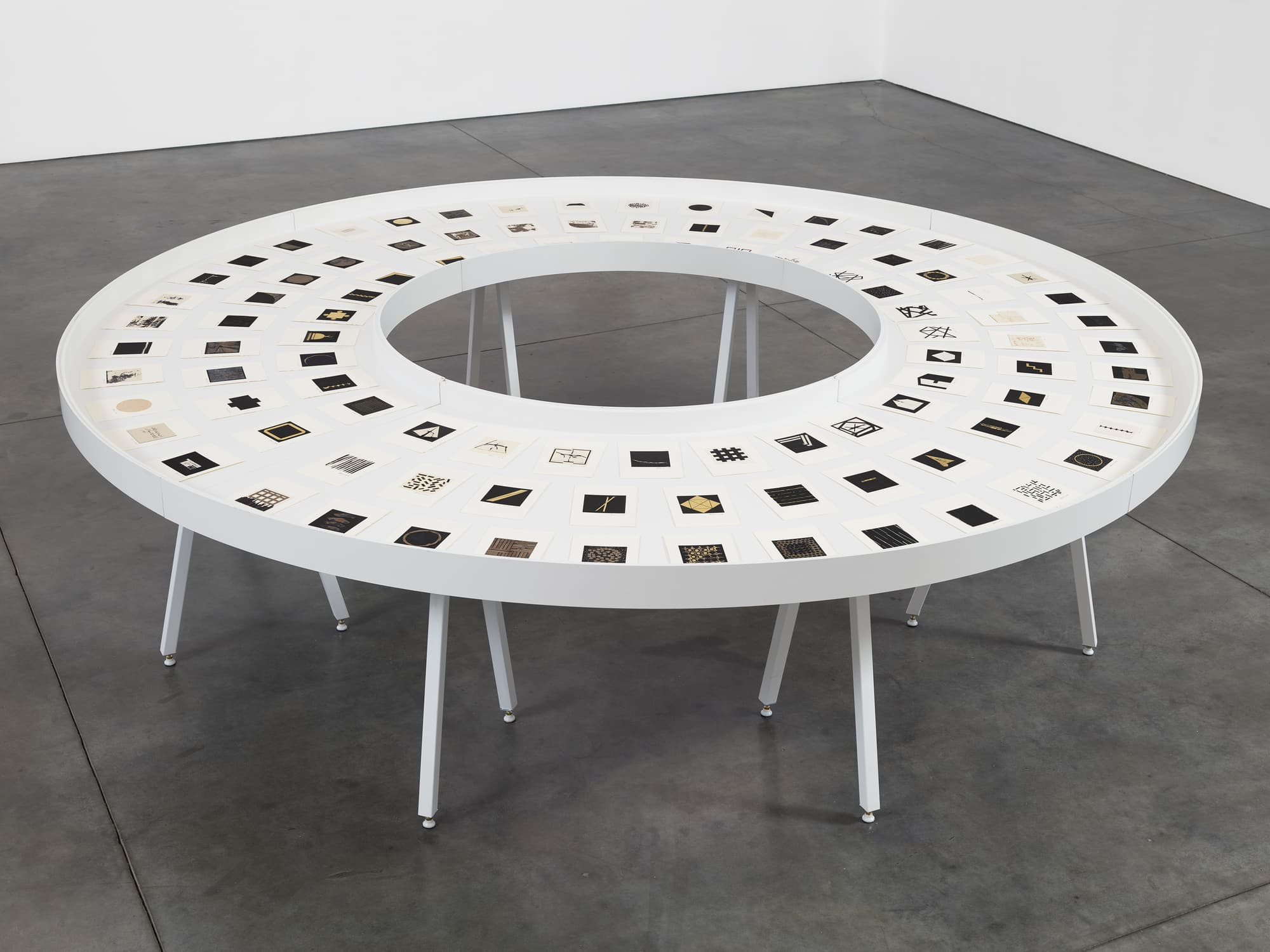 Zarina’s The Ten Thousand Things III, one hundred miniature collages arranged in a circular vitrine
