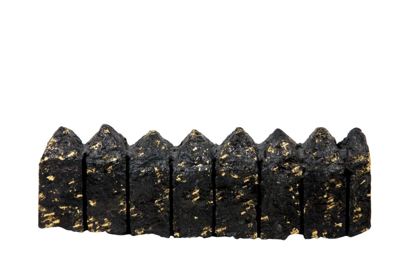 Houses, a horizontal cast-paper sculpture with pointed house-like forms and gold-leaf flecks, by Zarina