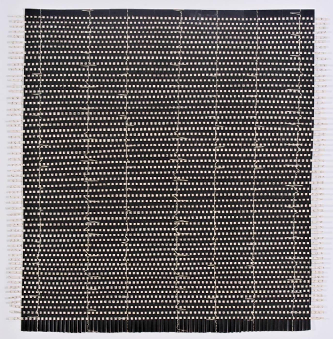 Weaving Memory, 2006, woven strips of woodcut and computer-generated text forming a tightly worked square field