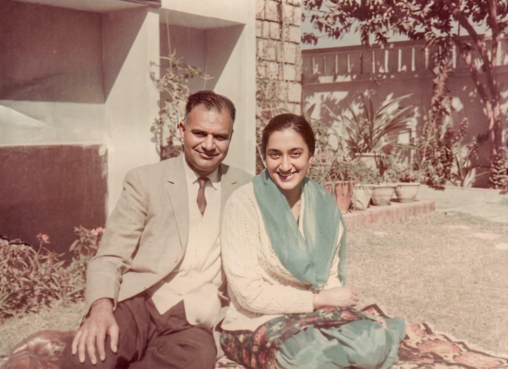 Mashkoor Chishti, left, and Rani seated outdoors in Lahore